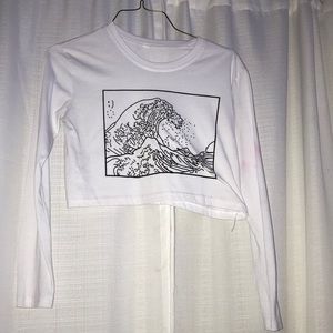A cropped white shirt with a wave on it